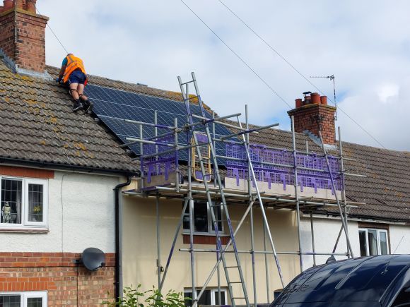 solar panels on roofs houses with scaffold