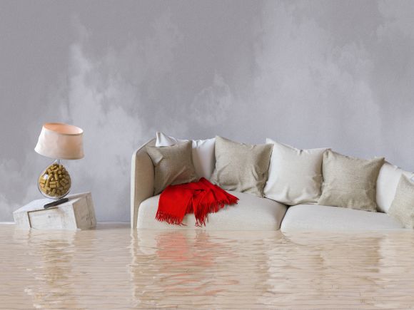 Contents Insurance - Sofa and side cabinet floating in flood water