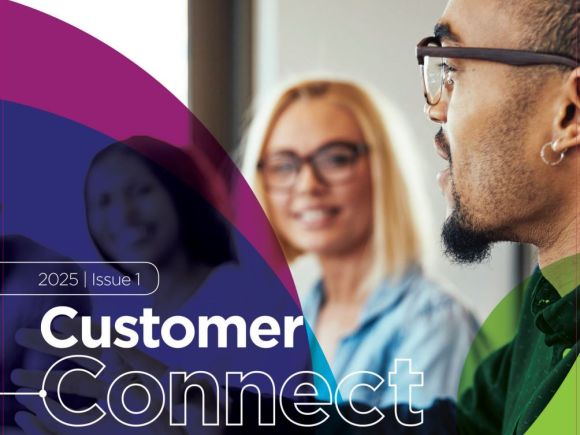 Title in white wording - Issue 1 - 2025 Customer Connect with a man and a lady talking and smiling in the background