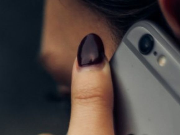 Woman holding a mobile phone to her ear