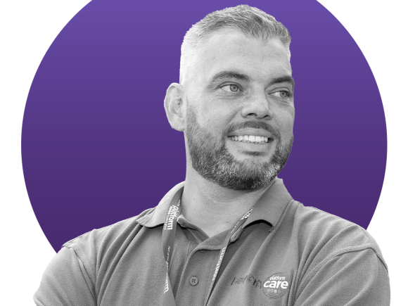 Black and white image of a man in a Platform polo shirt in front of a blue circle