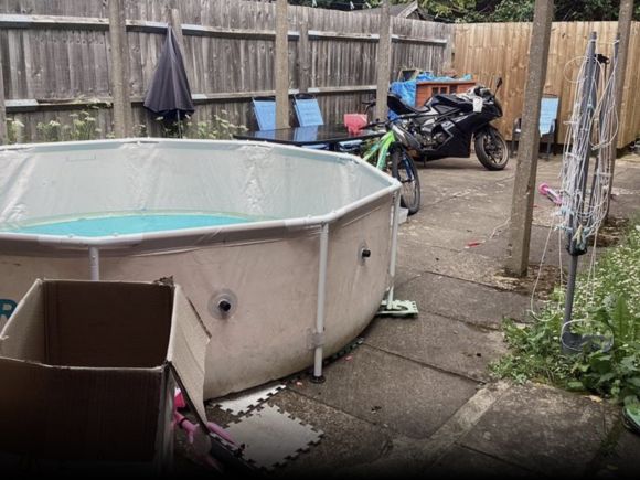 A communal area with a paddling pool in it