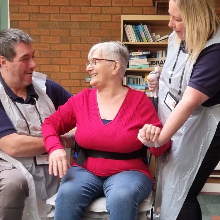 Falls Responders helping elderly lady