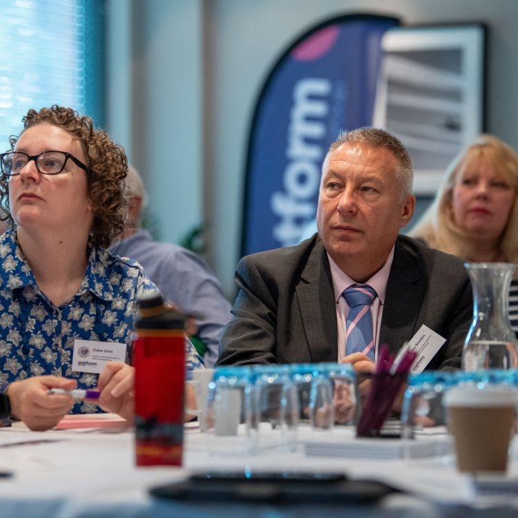 Involved customers watching a presentation