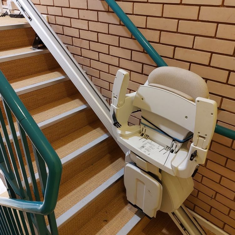 Stair lift at bottom of stairs