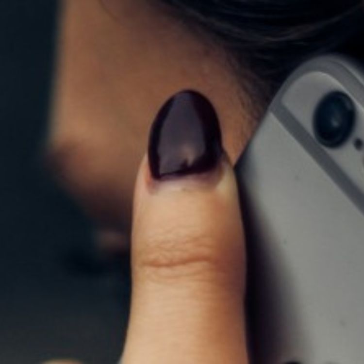 Woman holding a mobile phone to her ear