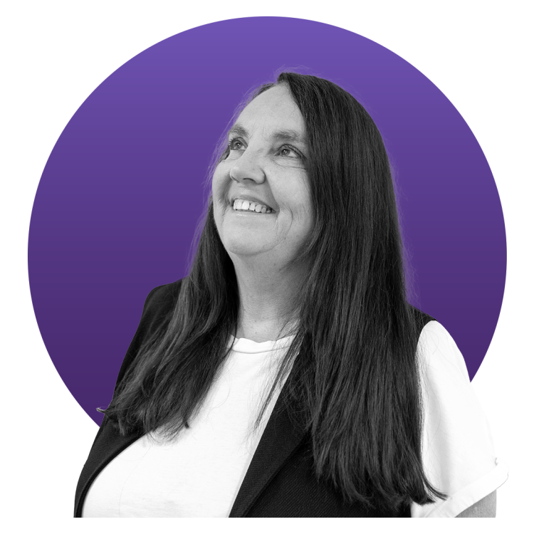 Black and white image of a woman in front of a blue circle background 