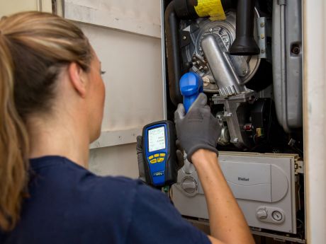 Gas engineer testing a boiler