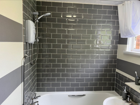 Bathroom complete with grey tiles