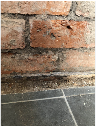 Rising damp - damp brickwork above the damp proof course level