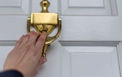 Person knocking on a door