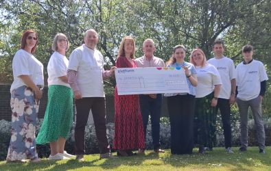 Dementia UK and Platform colleagues with a giant cheque