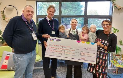 Lighthouse and Platform staff with a giant cheque