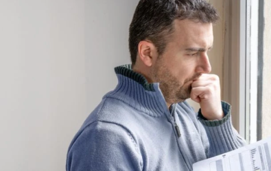 One man worried about bills reading energy increase costs